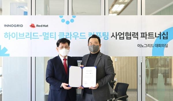 김명진 이노그리드 대표(오른쪽)와 김경상 한국레드햇 대표 / 이노그리드